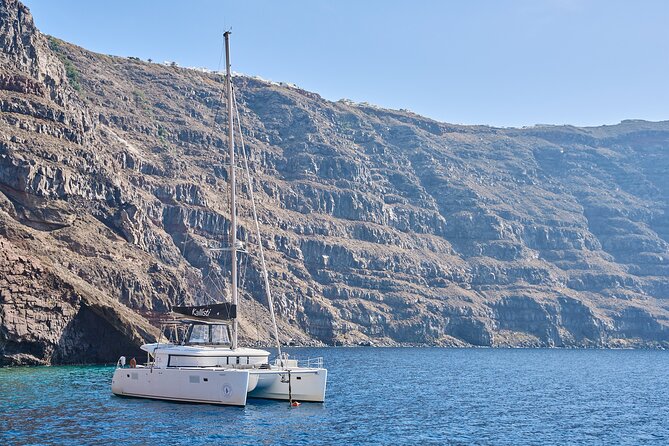Santorini: Luxury Catamaran Cruise with Fresh Fish BBQ & Drinks - Getting to the pier: Imerovigli pickup and the one place to be strict