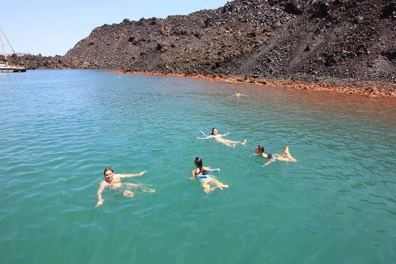 Santorini: Luxury Catamaran Cruise with Lunch, BBQ & Drinks - Thirasia island and the lunch-then-swim rhythm