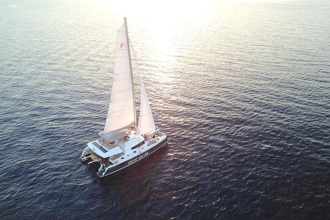 Santorini Luxury Catamaran Sunset Cruise with BBQ, Drink and Transfer - From Ammoudi in Oia to a luxury sunset cruise