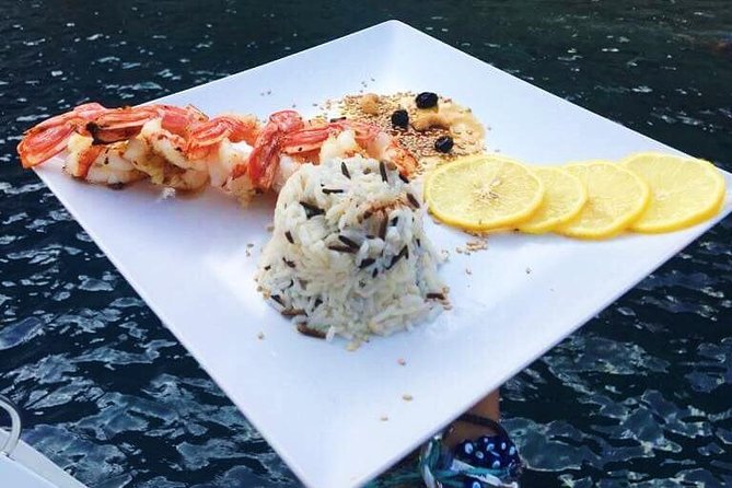 Santorini Luxury Catamaran Sunset Cruise with BBQ, Drink and Transfer - Volcano sailing: seeing Santorini from the sea-level angle