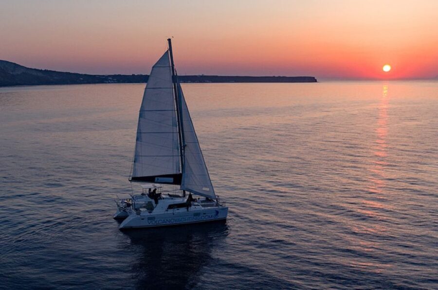 Santorini: Luxury Sunset Cruise with Dinner & Open Bar - Black, white, and red beach stops: scenery first, not beach-lounging