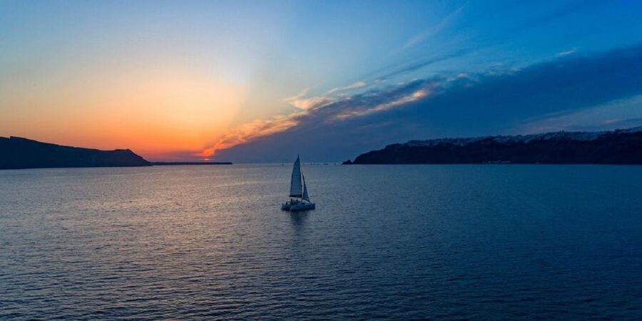 Santorini: Luxury Sunset Cruise with Dinner & Open Bar - Dinner at the lighthouse area: food on the water, not after it