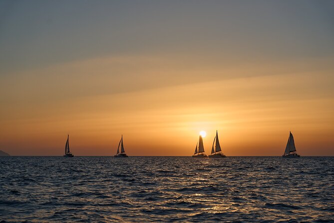 Santorini Oia: Luxury Sunset Cruise with Fresh Fish BBQ & Drinks - A small-group Santorini sunset cruise built for real sea time