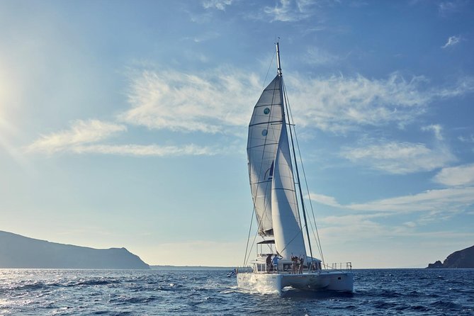 Santorini Sunset Luxury Sailing Catamaran Cruise with BBQ, drinks, transfer - Volcano time without the intimidation: hot springs and caldera viewpoints