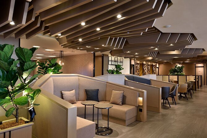 Singapore Changi Airport Plaza Premium Lounge at Terminal 1 - Comfort setup: seating, TV, and charging when you need them most