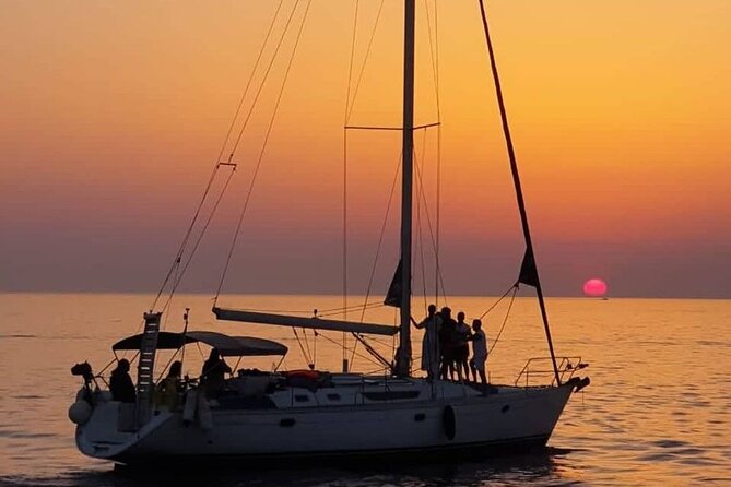 Sunset Tour on a Luxury Sailing Yacht from Vilamoura - Stop 2: A tiny sea-only beach with clay on one side and rock on the other