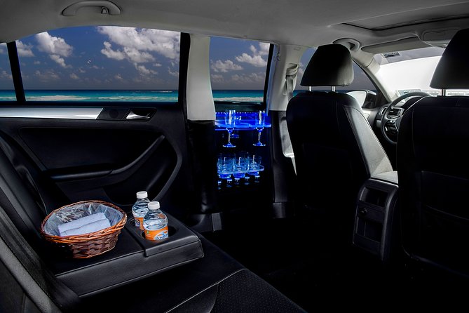 Transfers in Luxury Sedan from Cancun Airport - Finding Your Driver in Cancun: Tablet, Green Shirt, and WhatsApp